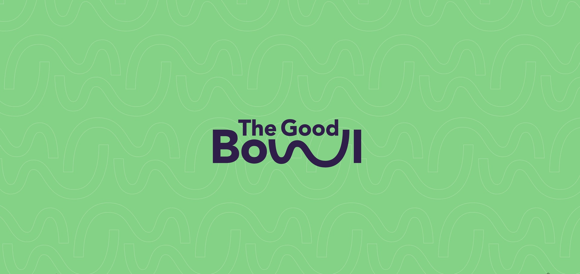 The Good Bowl logo in dark plum on a green patterned background